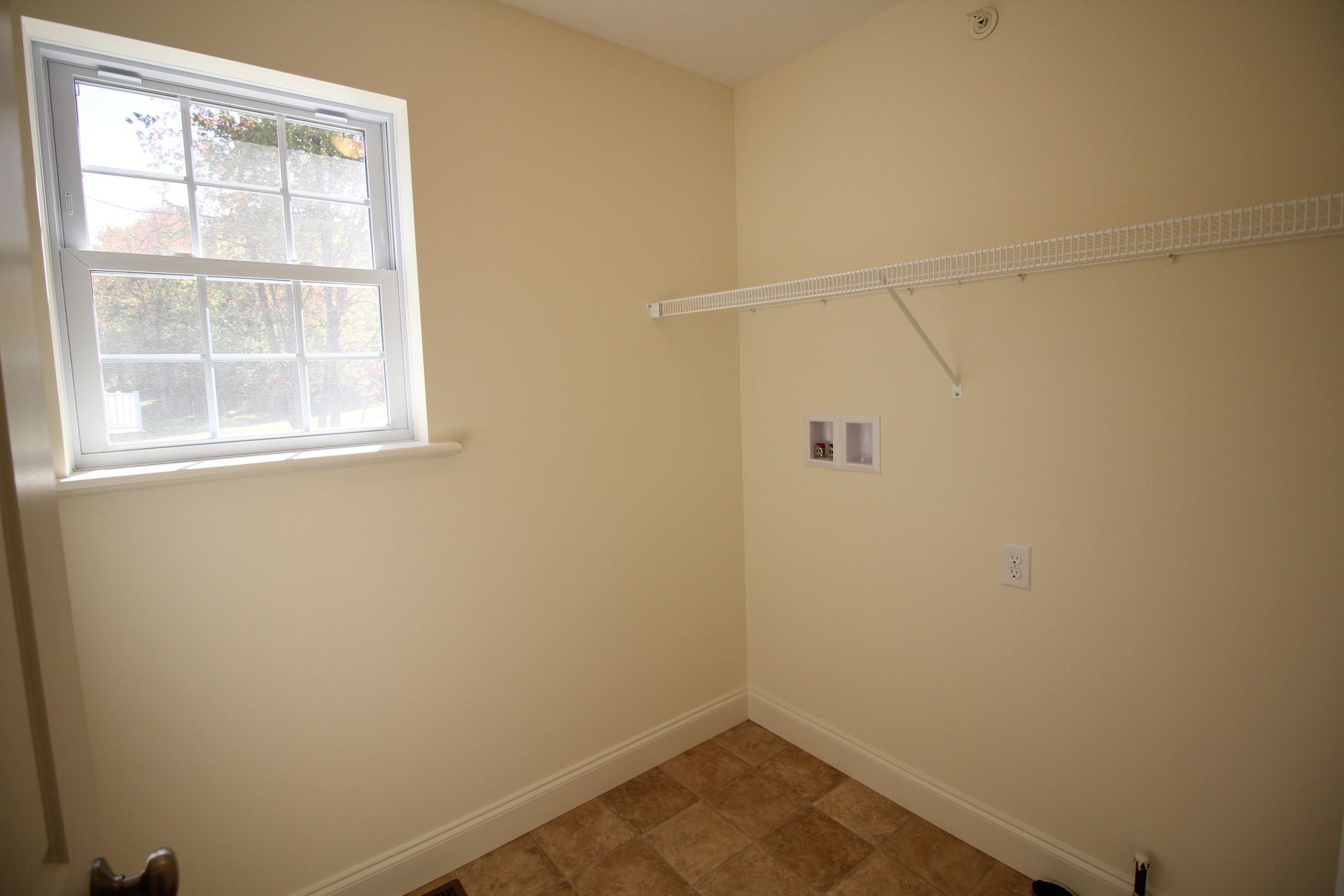 There is a window in the corner of the room.