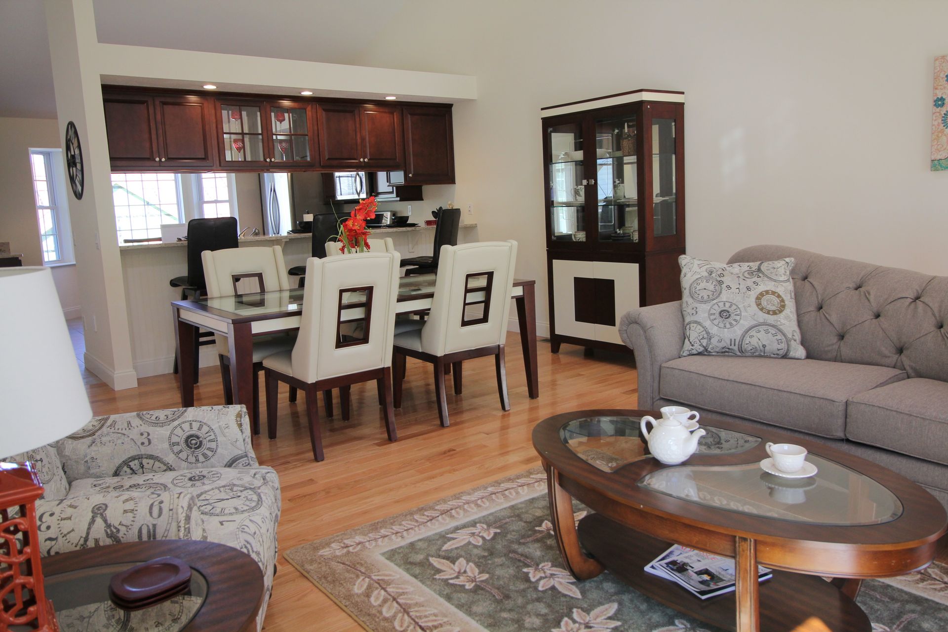 A living room with a couch a table and chairs