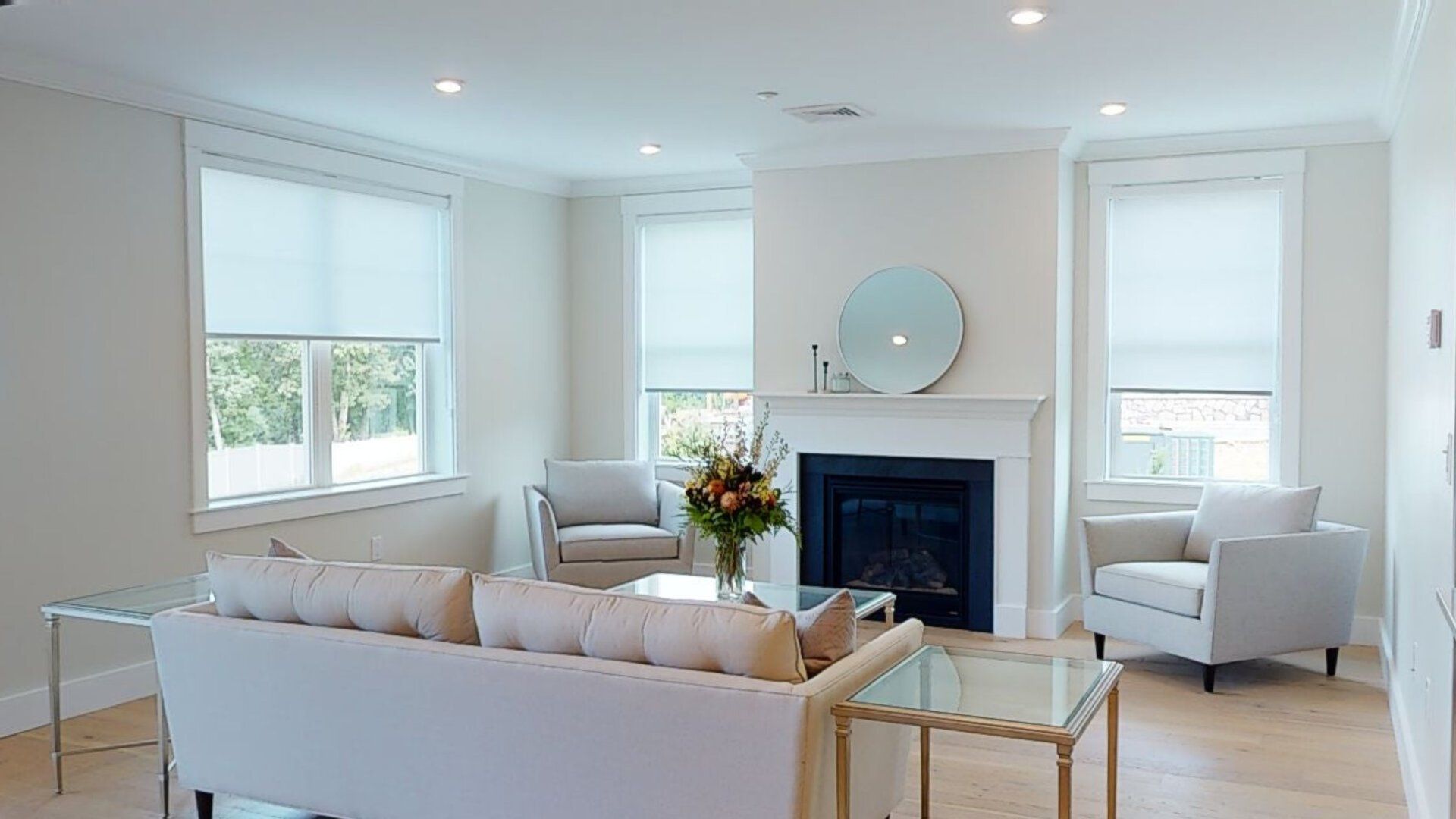 There is a fireplace in the middle of the living room.