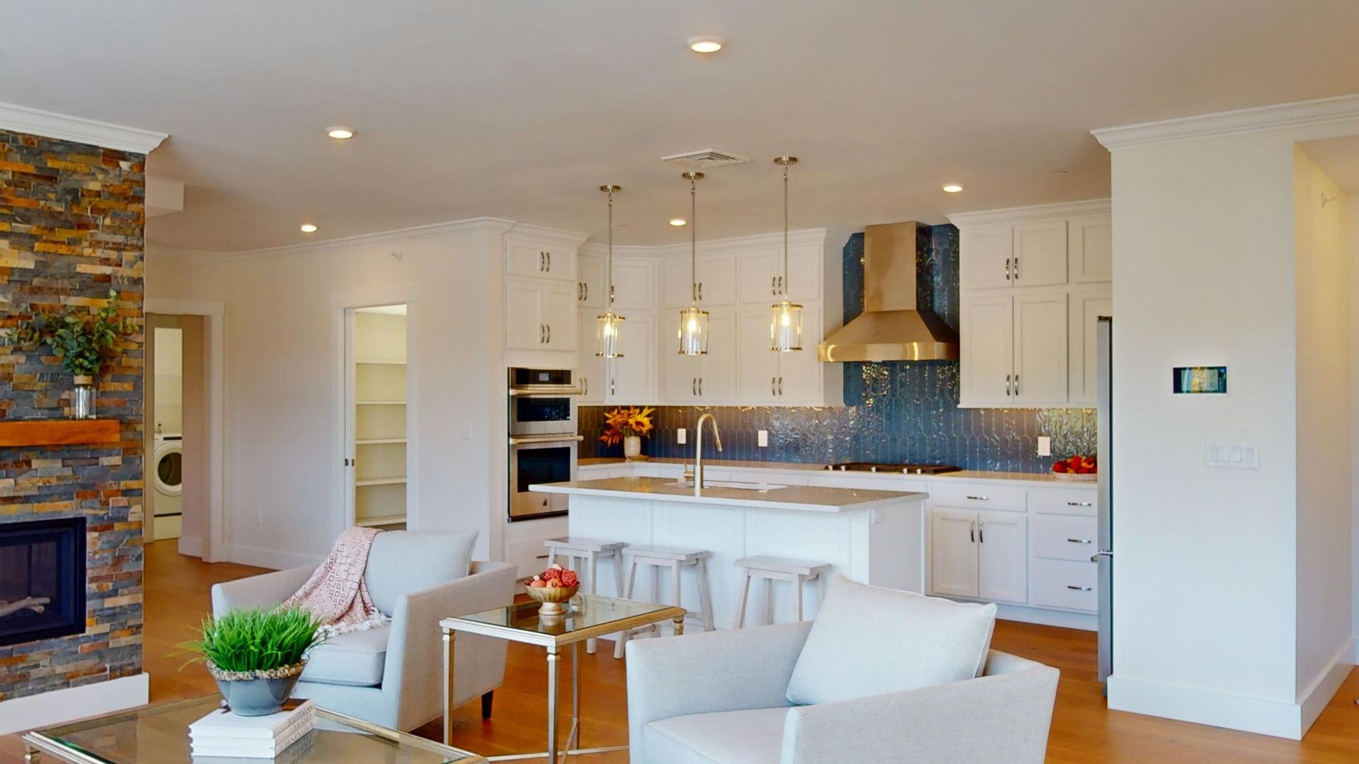 A living room with a couch , chairs , and a table.