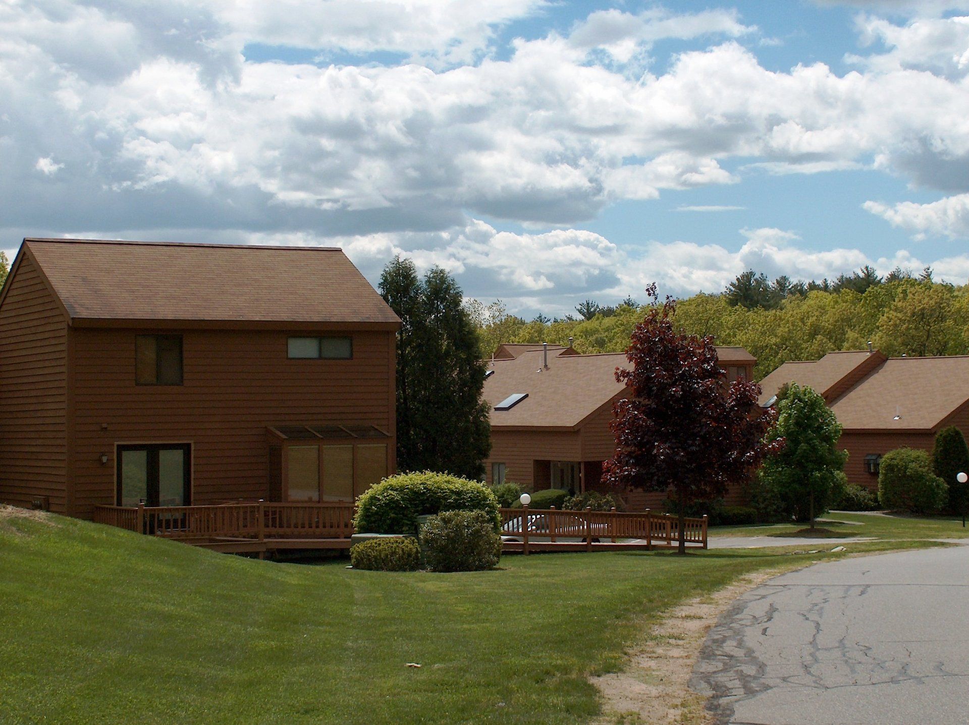 A row of houses in a residential area with a blue sky in the background