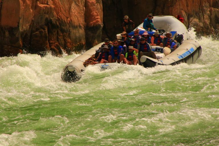 A group of people are rafting down a river.