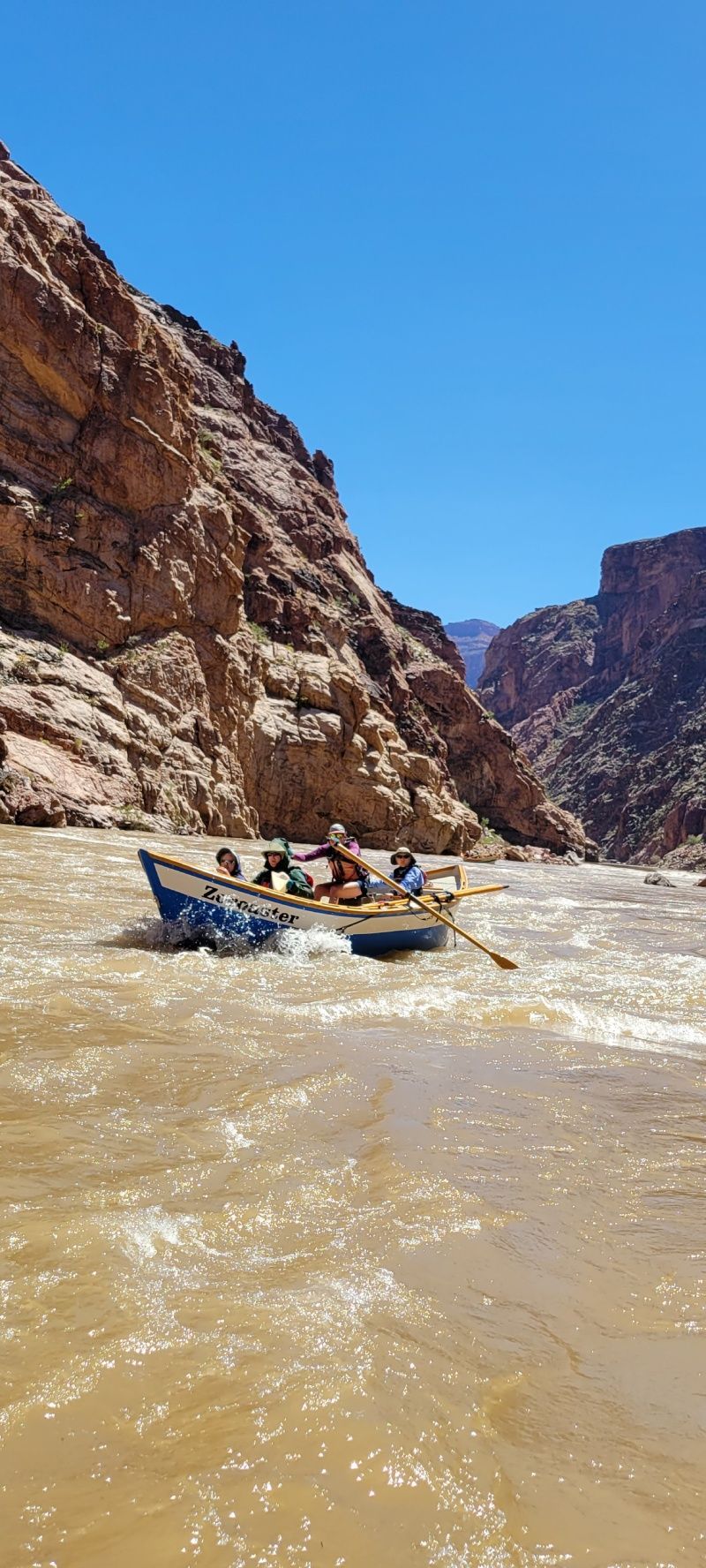A group of people are rafting down a river.