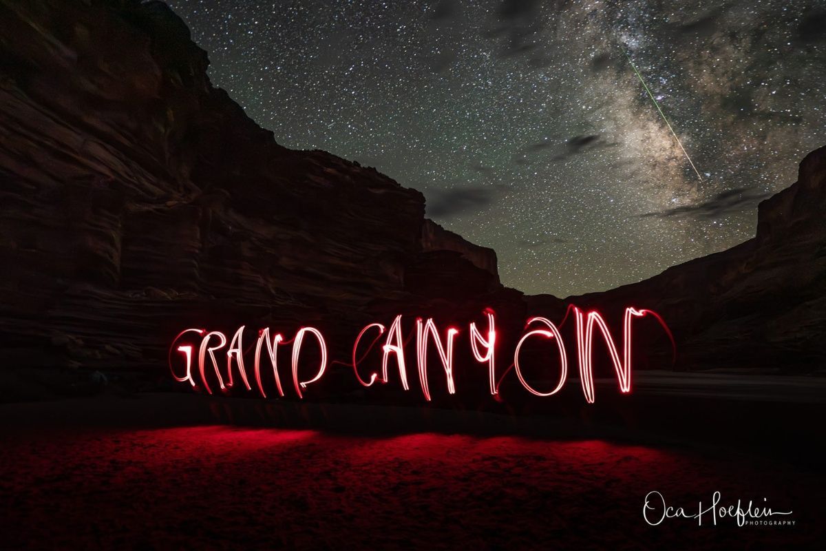 The word grand canyon is written in red light