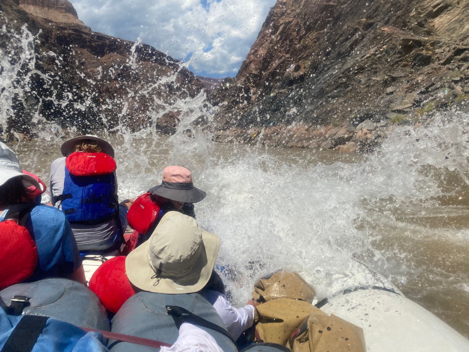 A group of people are rafting down a river.