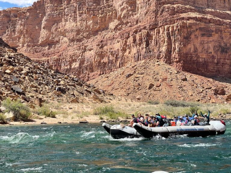 A group of people are rafting down a river.