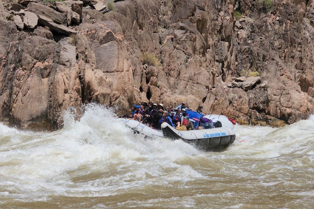A group of people are rafting down a river.