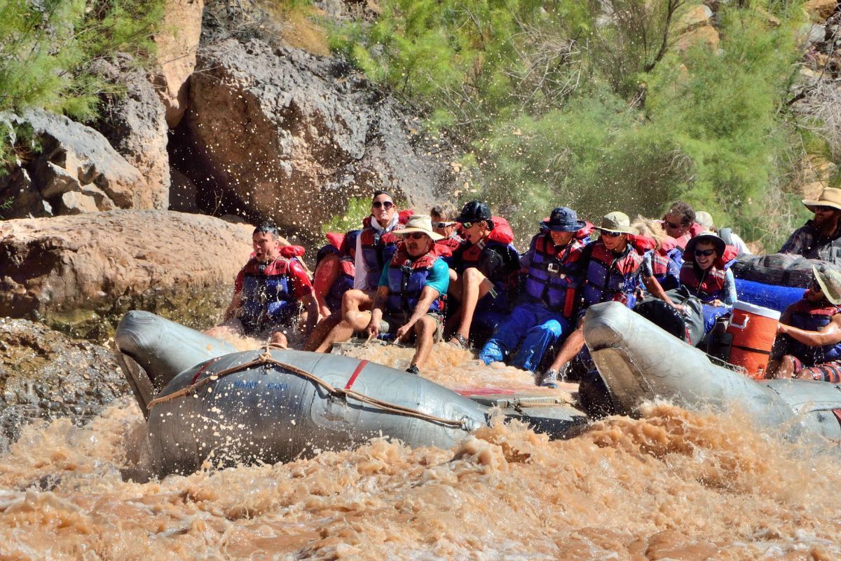 A group of people are rafting down a river