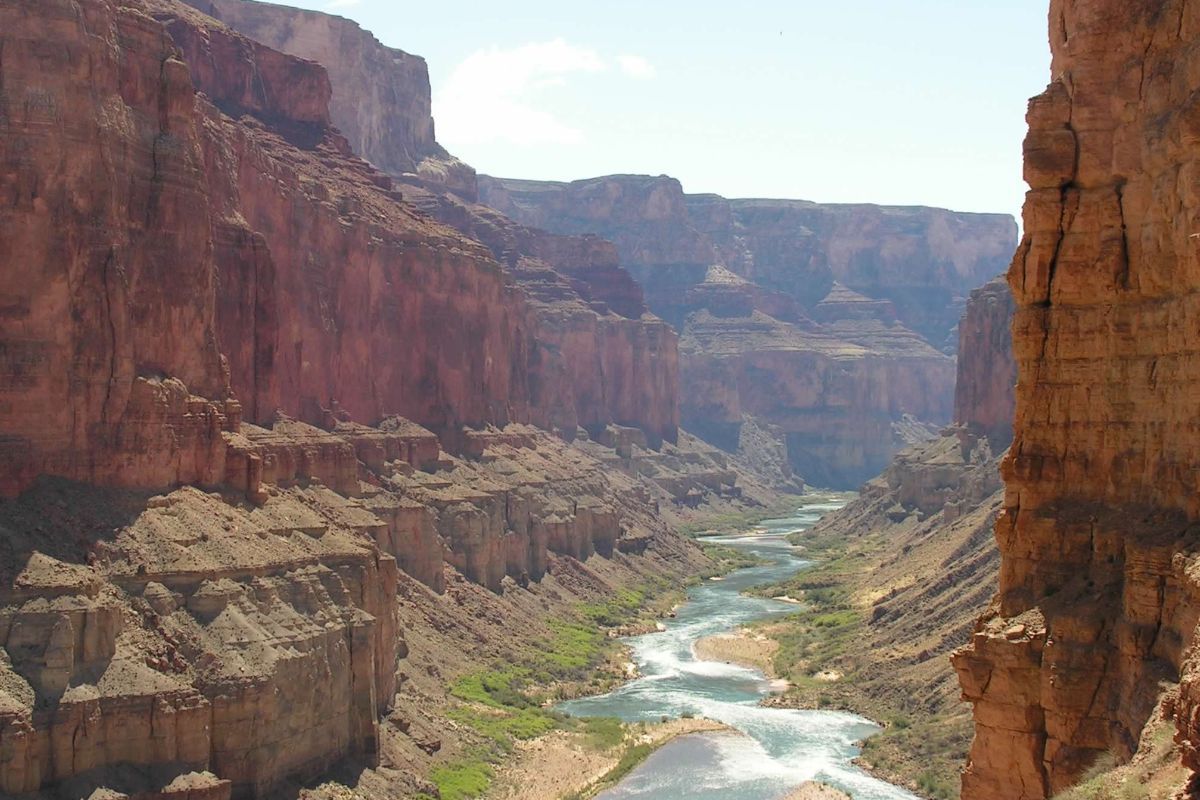 A river flowing through a canyon surrounded by rocks