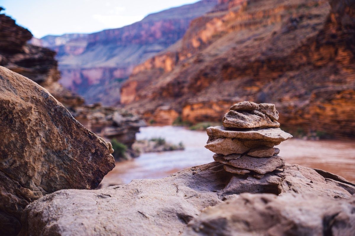 A pile of rocks stacked on top of each other in the middle of a canyon.