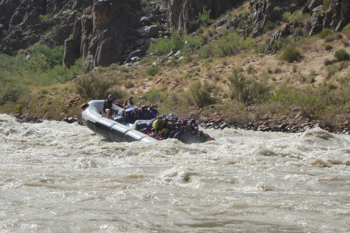 A group of people are rafting down a river.