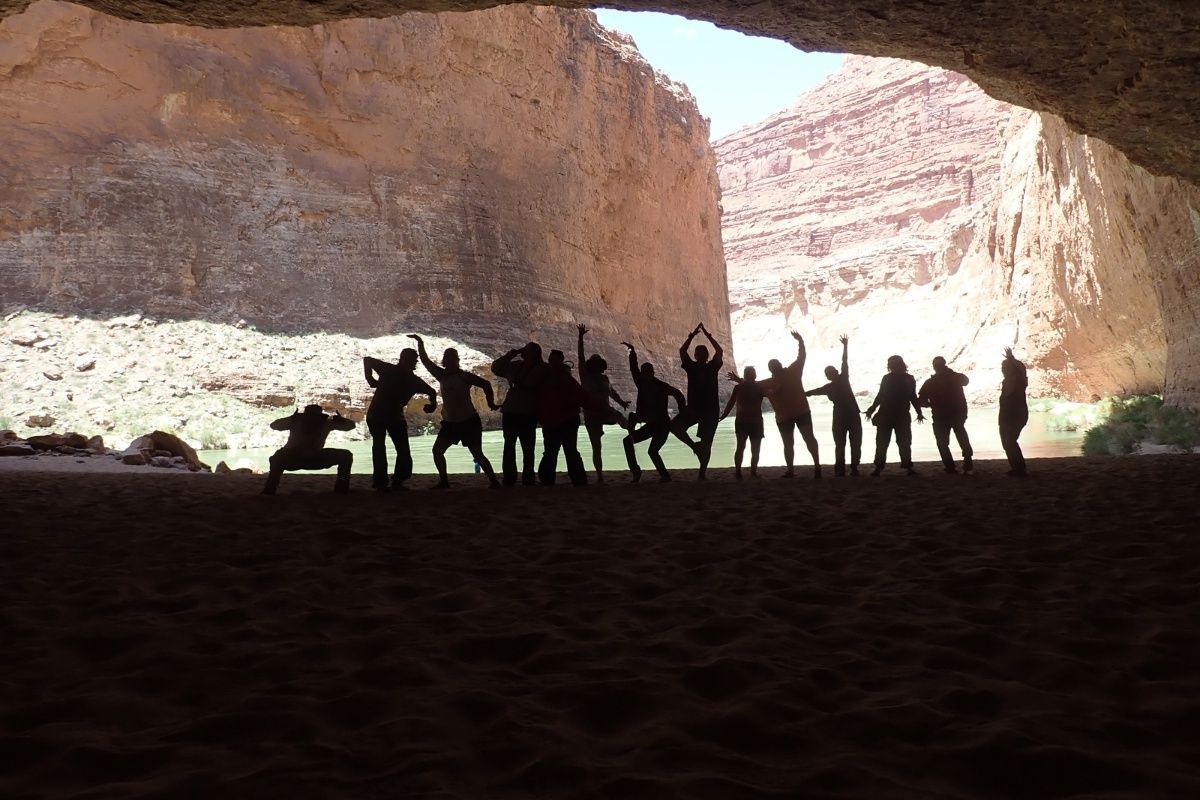 A group of people are posing for a picture in a cave