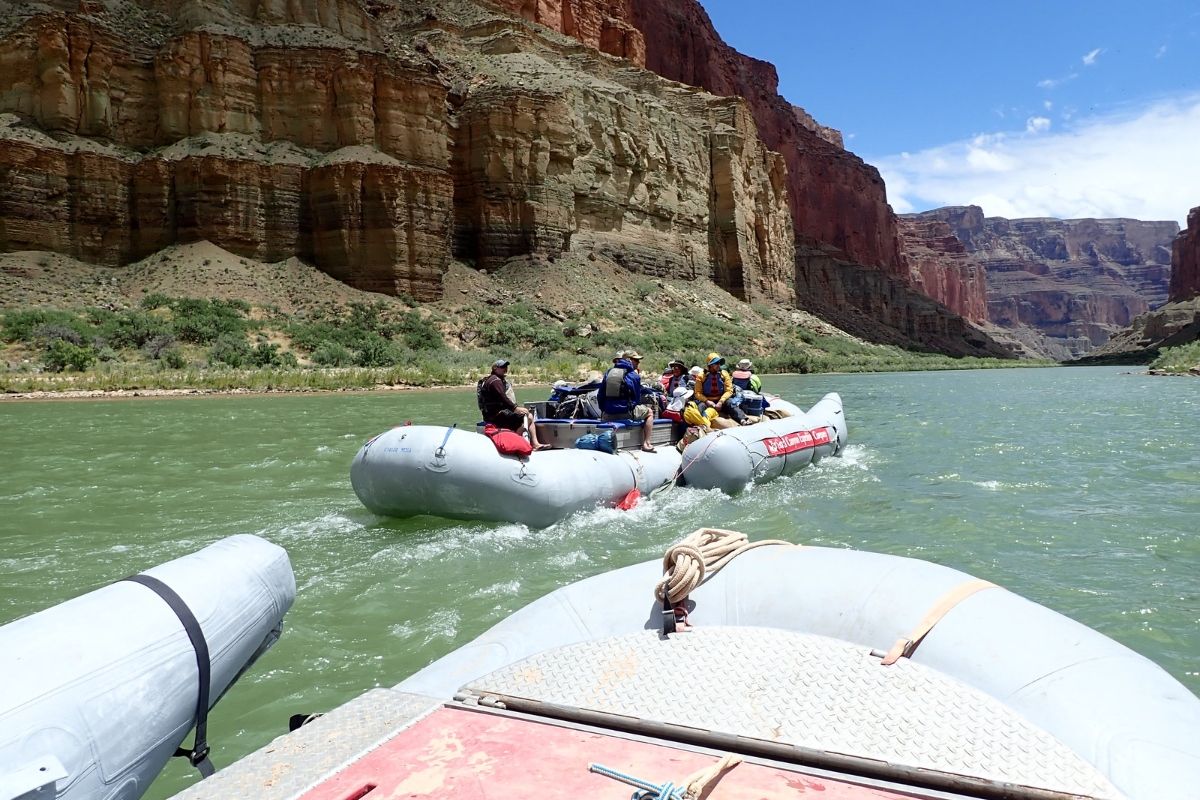 A group of people are rafting down a river