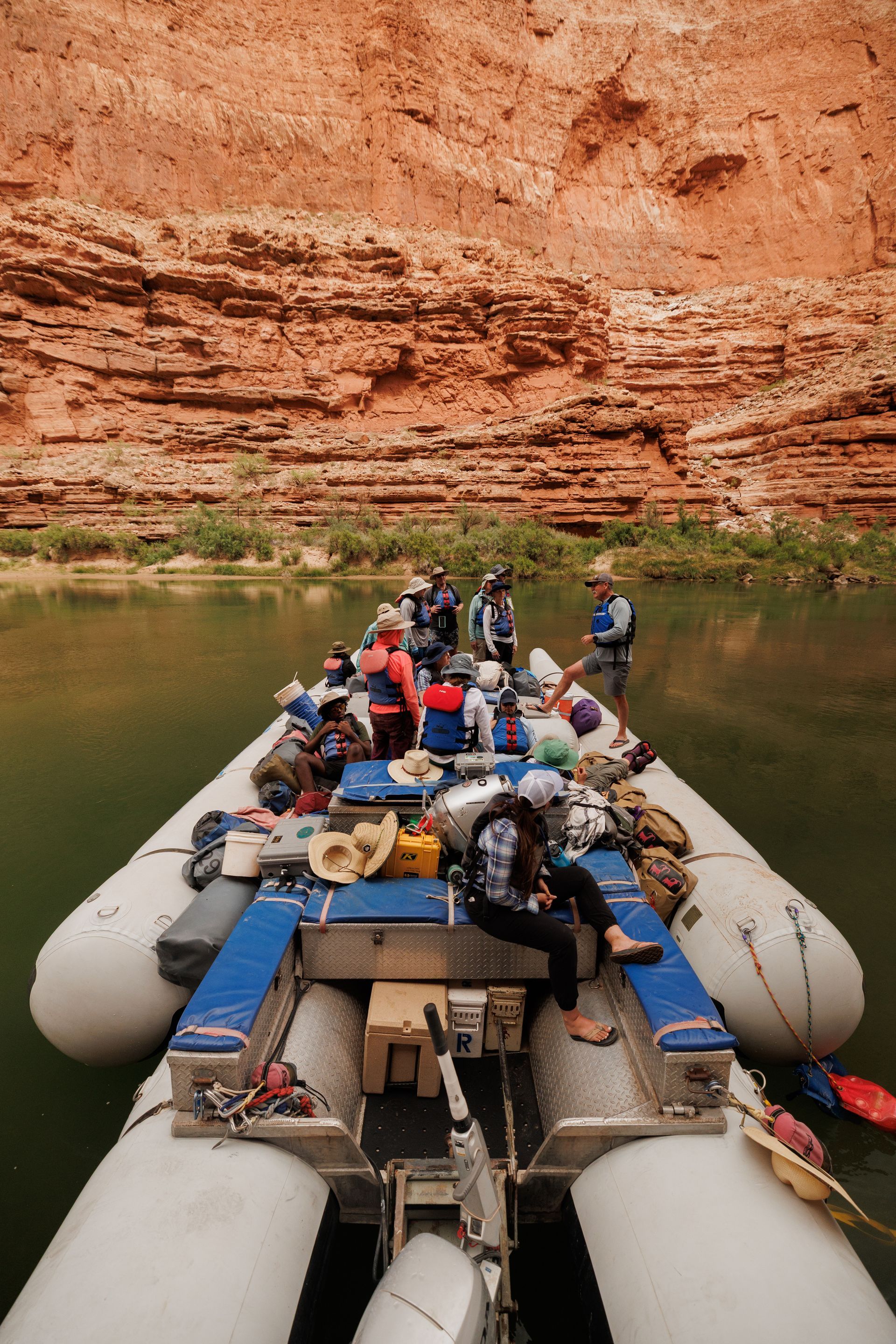 A group of people are on a raft in the water.