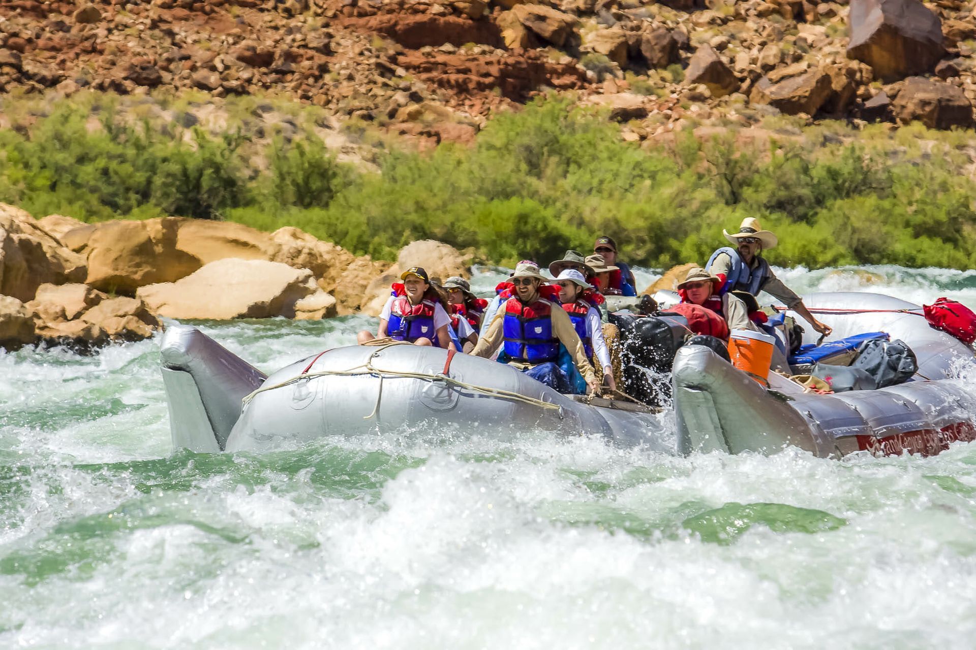 A group of people are rafting down a river.