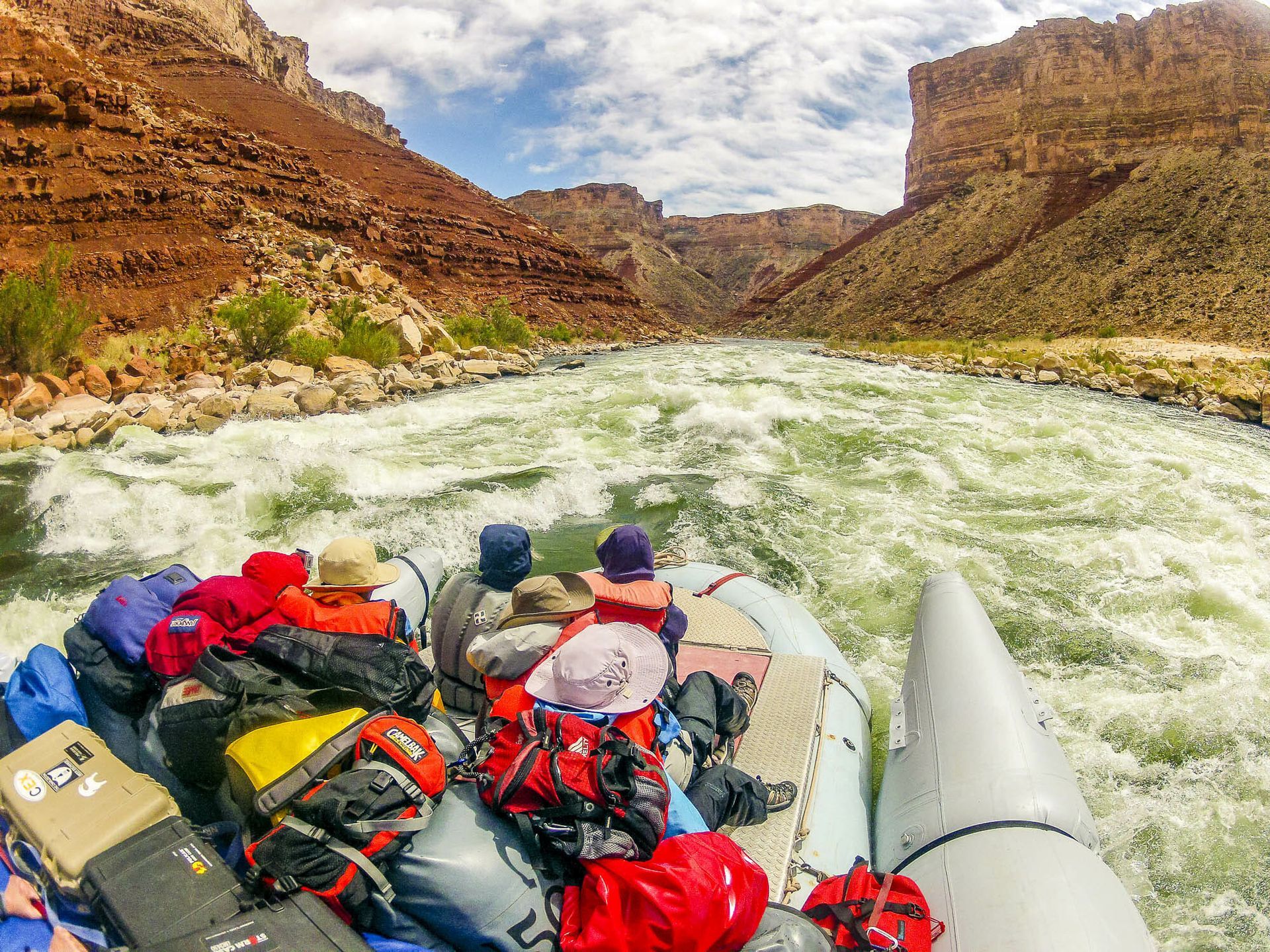 A group of people are rafting down a river.
