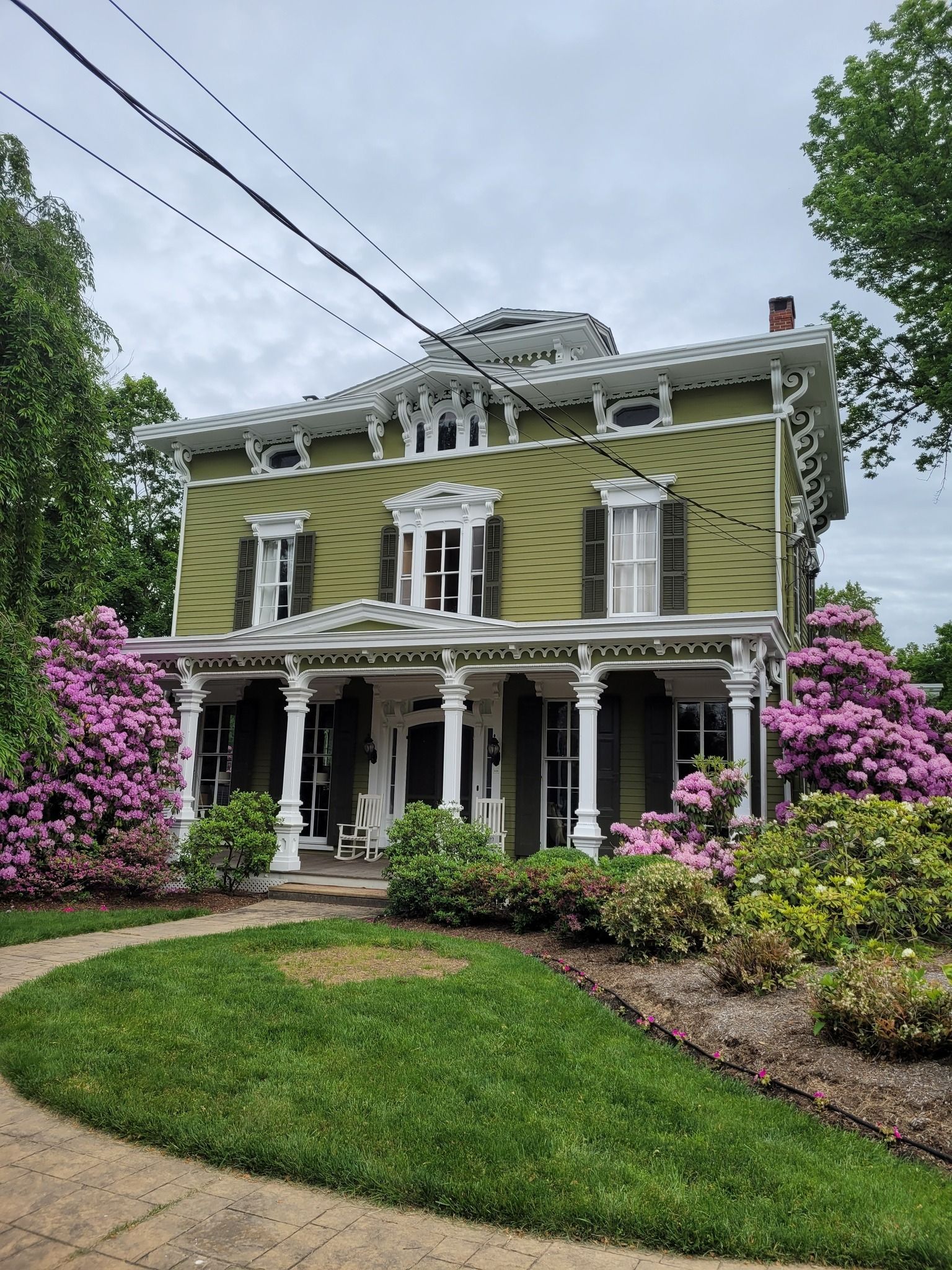 Green painted walls of home exterior.