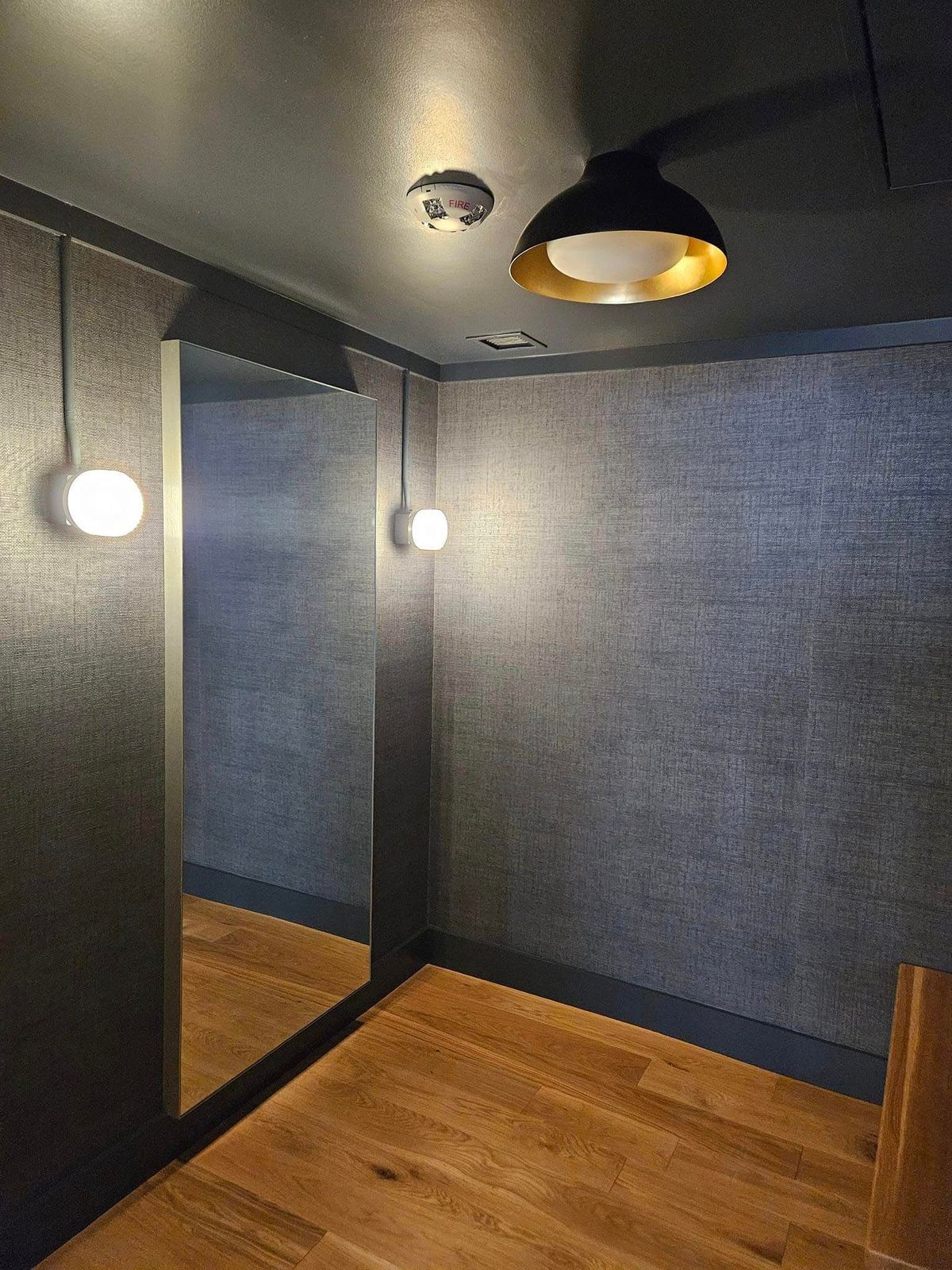 There is a large mirror in the middle of the room.