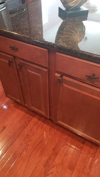 Kitchen counter with newly refurnished wooden cabinets. 