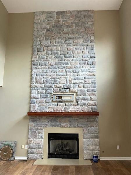 There is a fireplace in the middle of the room.