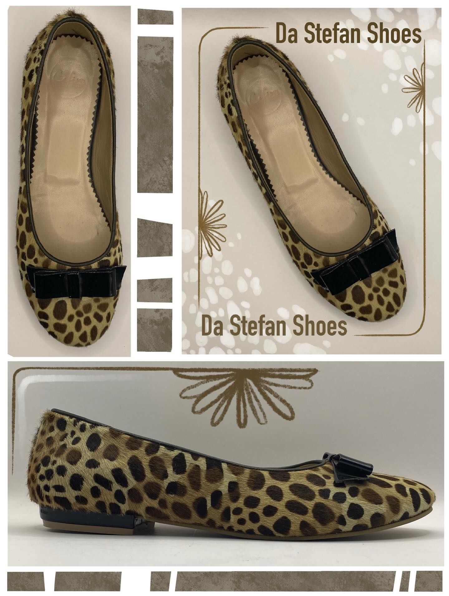 Leopard print ballet flats with a black bow; 