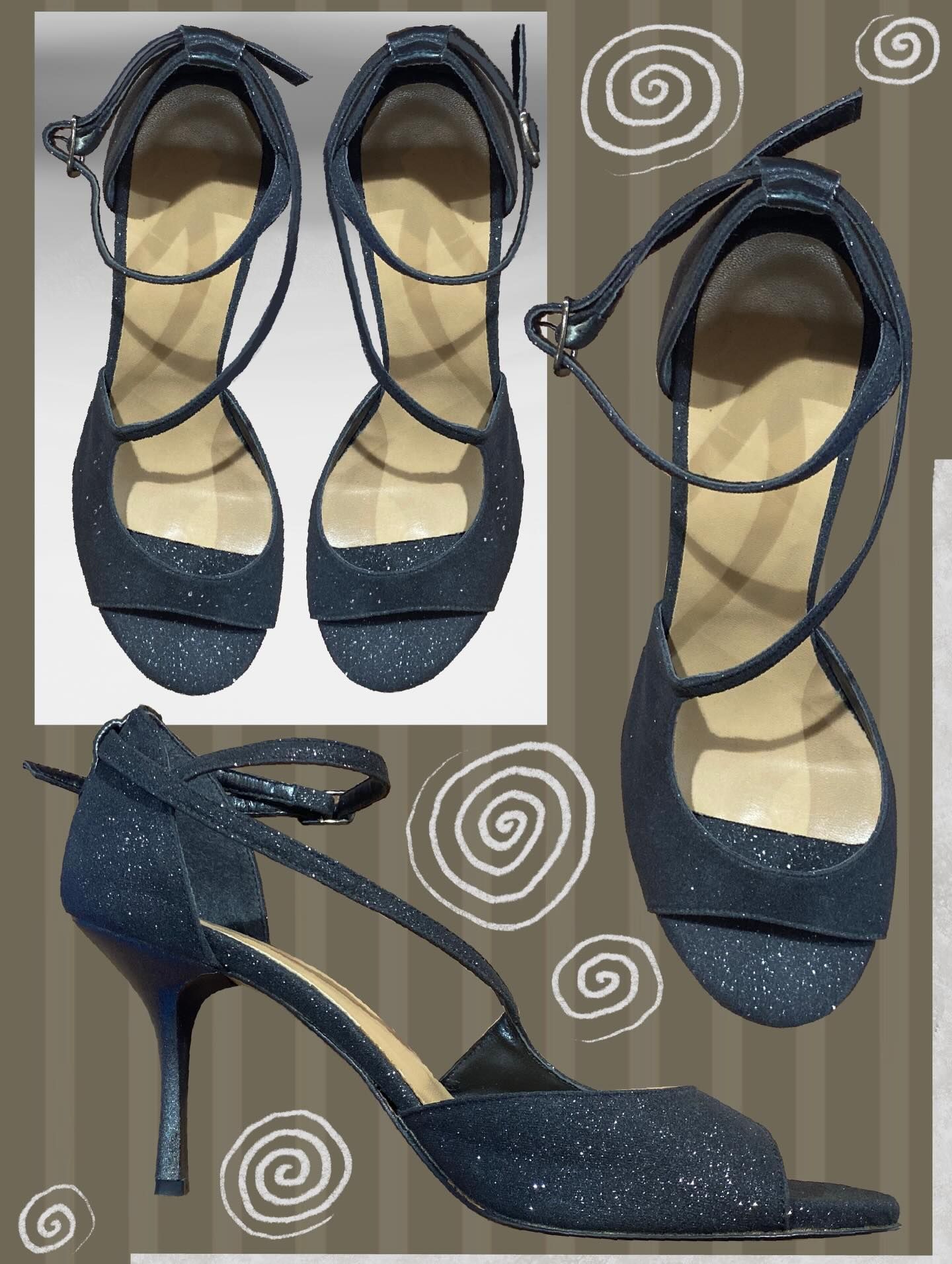 Sparkly navy blue high-heeled sandals with ankle straps.