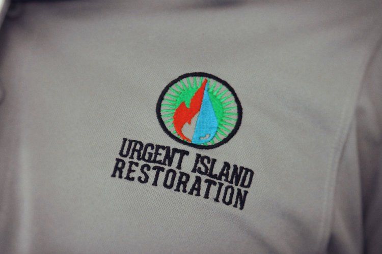 Company Logo On Shirt — Honolulu, HI — Urgent Island Restoration (Baseyard)