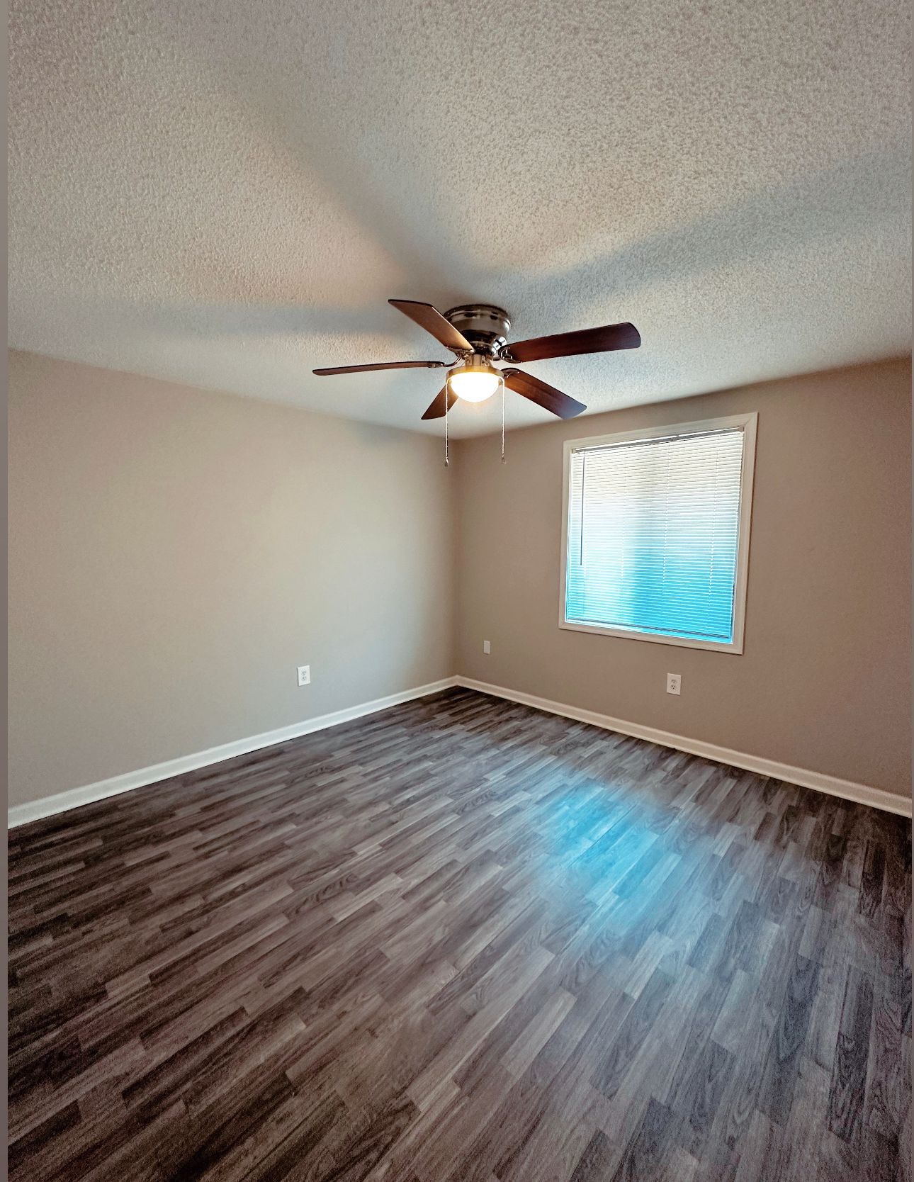 Photo of a bedroom with a ceiling fan