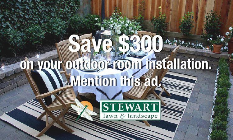 An ad for stewart lawn and landscape shows a table and chairs