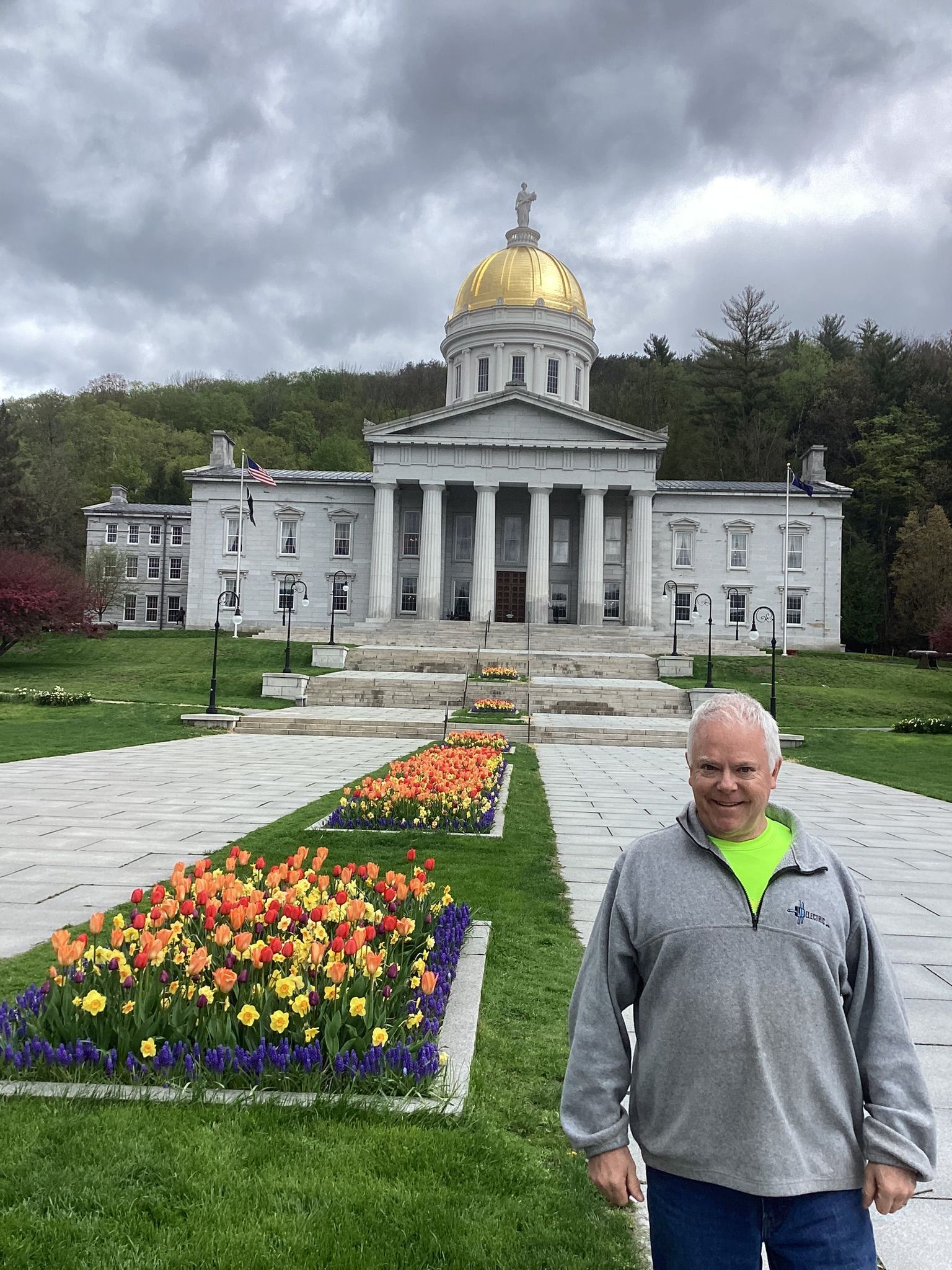 Matt Hill stands in front of the Montpelier Capitol building