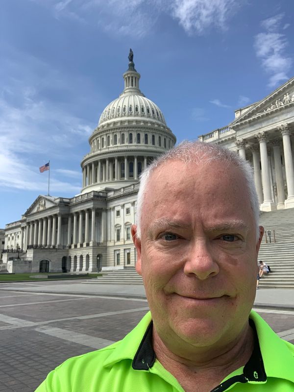 Matt Hill stands in front of the White House