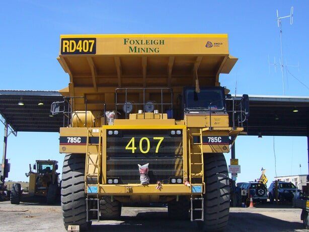 Mining Truck with Reflective Signage at Front in Mackay 