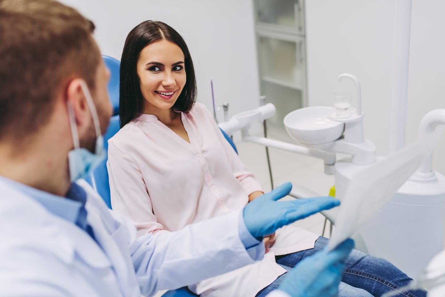 Dentist Looking At X-ray In Modern Clinic - Dental Treatments in Port Macquarie, NSW