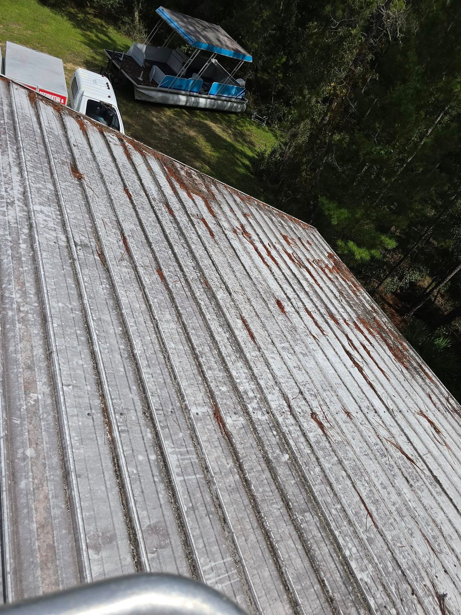 A boat is parked on the roof of a building.
