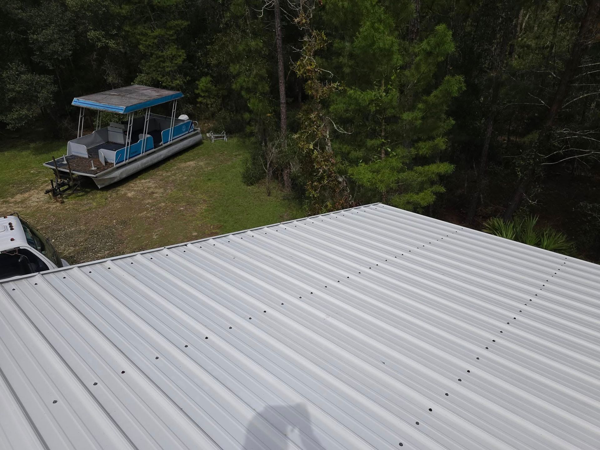 A boat is parked on the roof of a building.