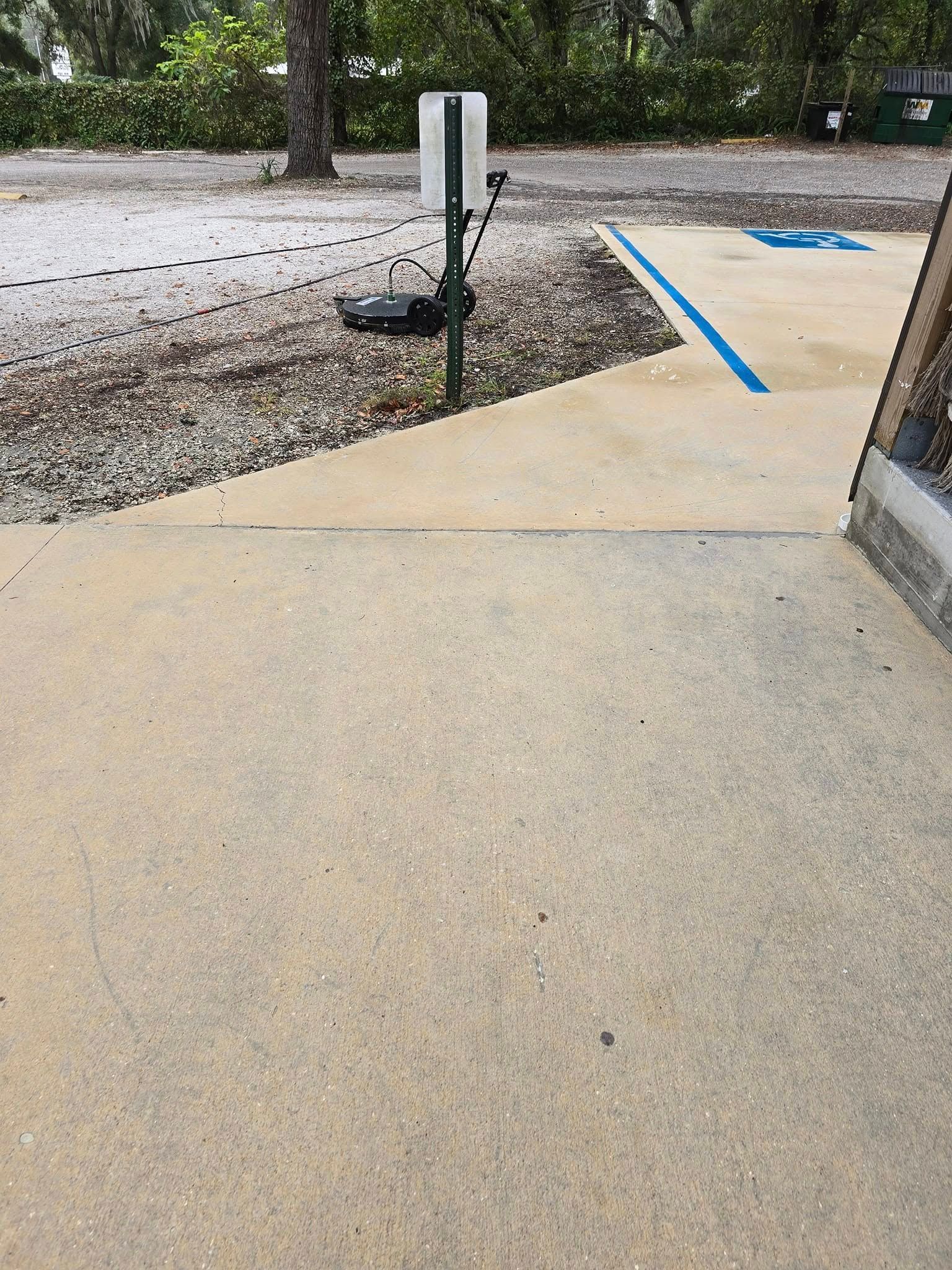 There is a handicapped parking spot on the side of the road.