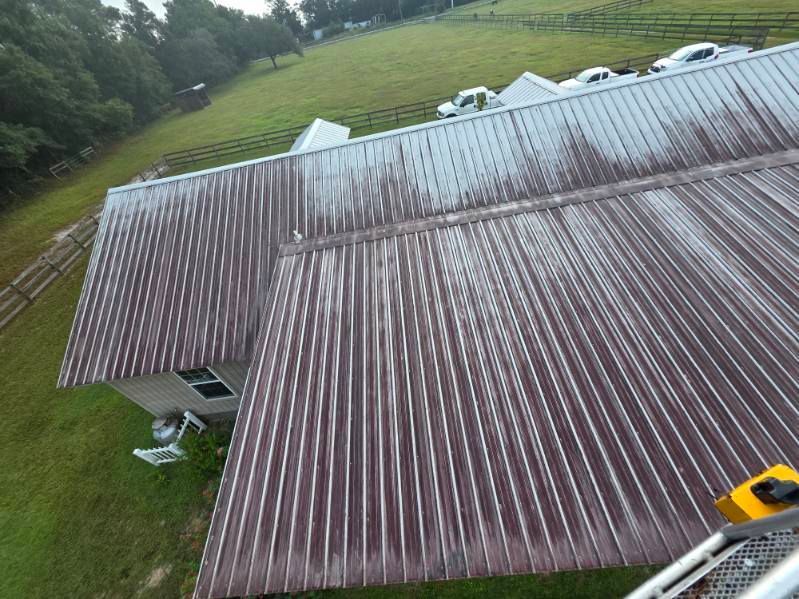 A motorcycle is parked in front of a building with the number 13 on it