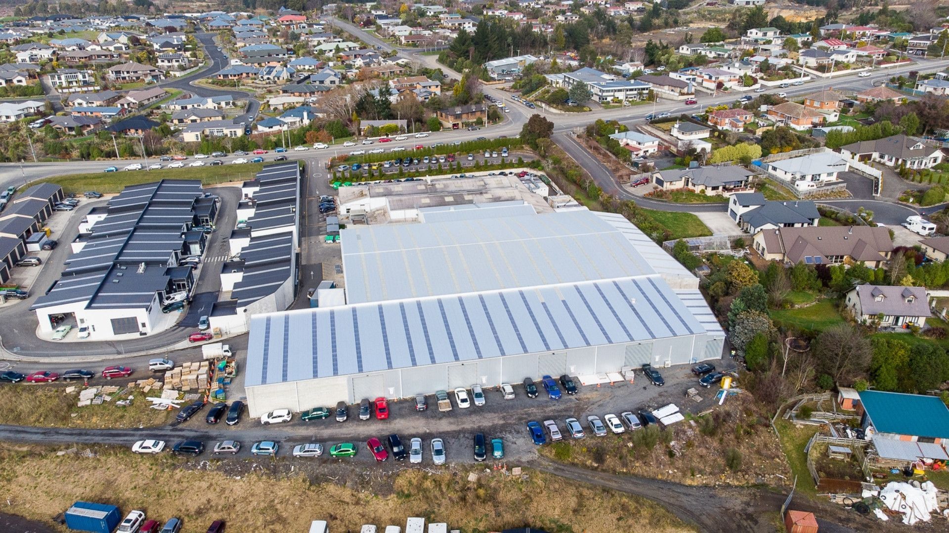An aerial view of a large building in the middle of a city.
