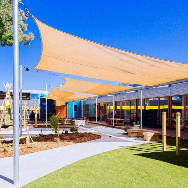 A building with a lot of shade sails on it