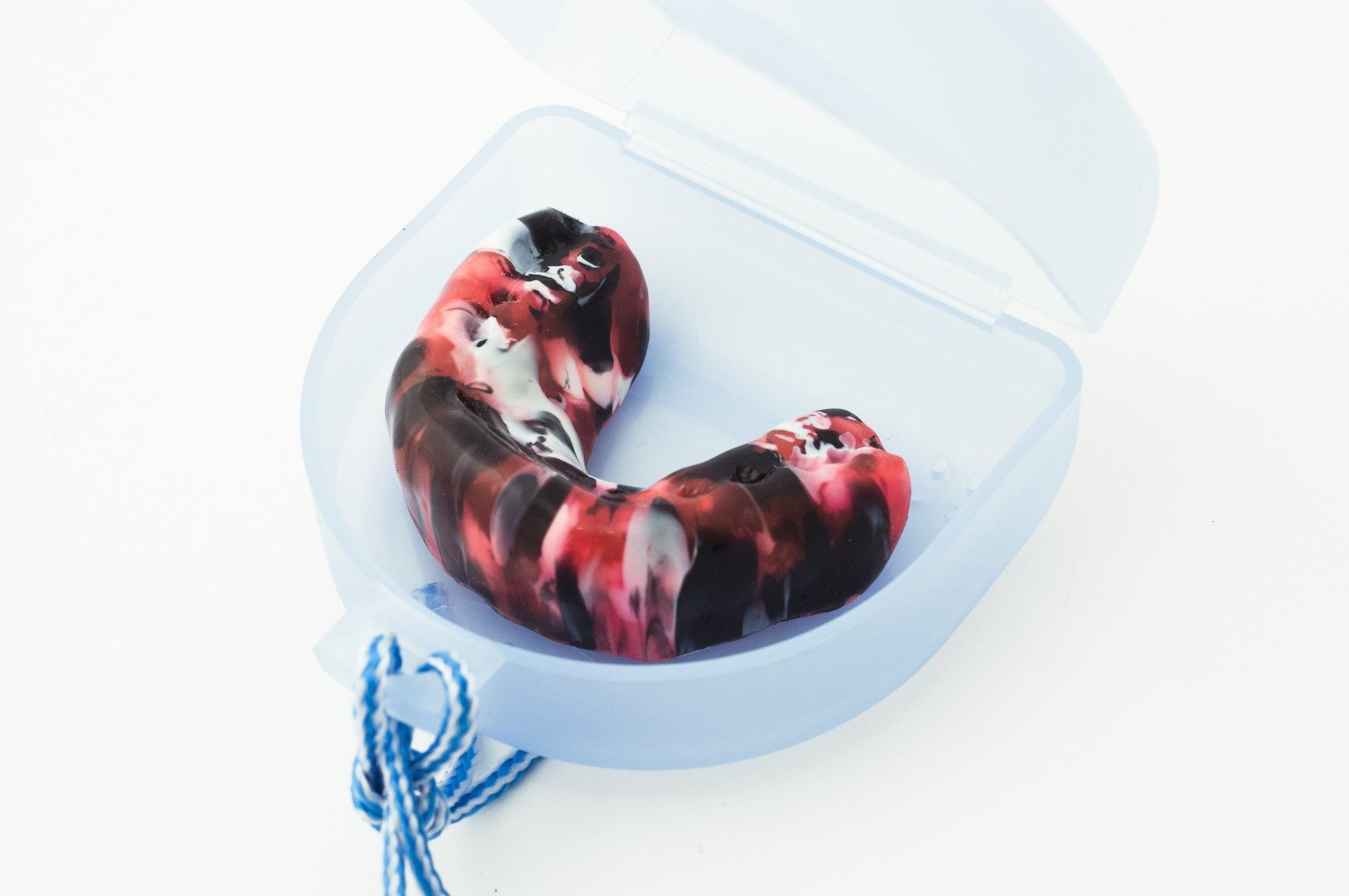 mouthguard in red and blue case