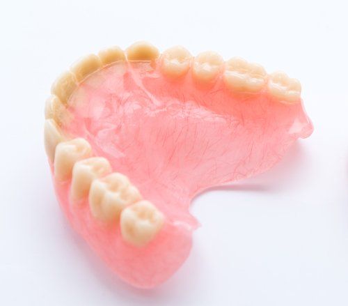 half of a mouth denture