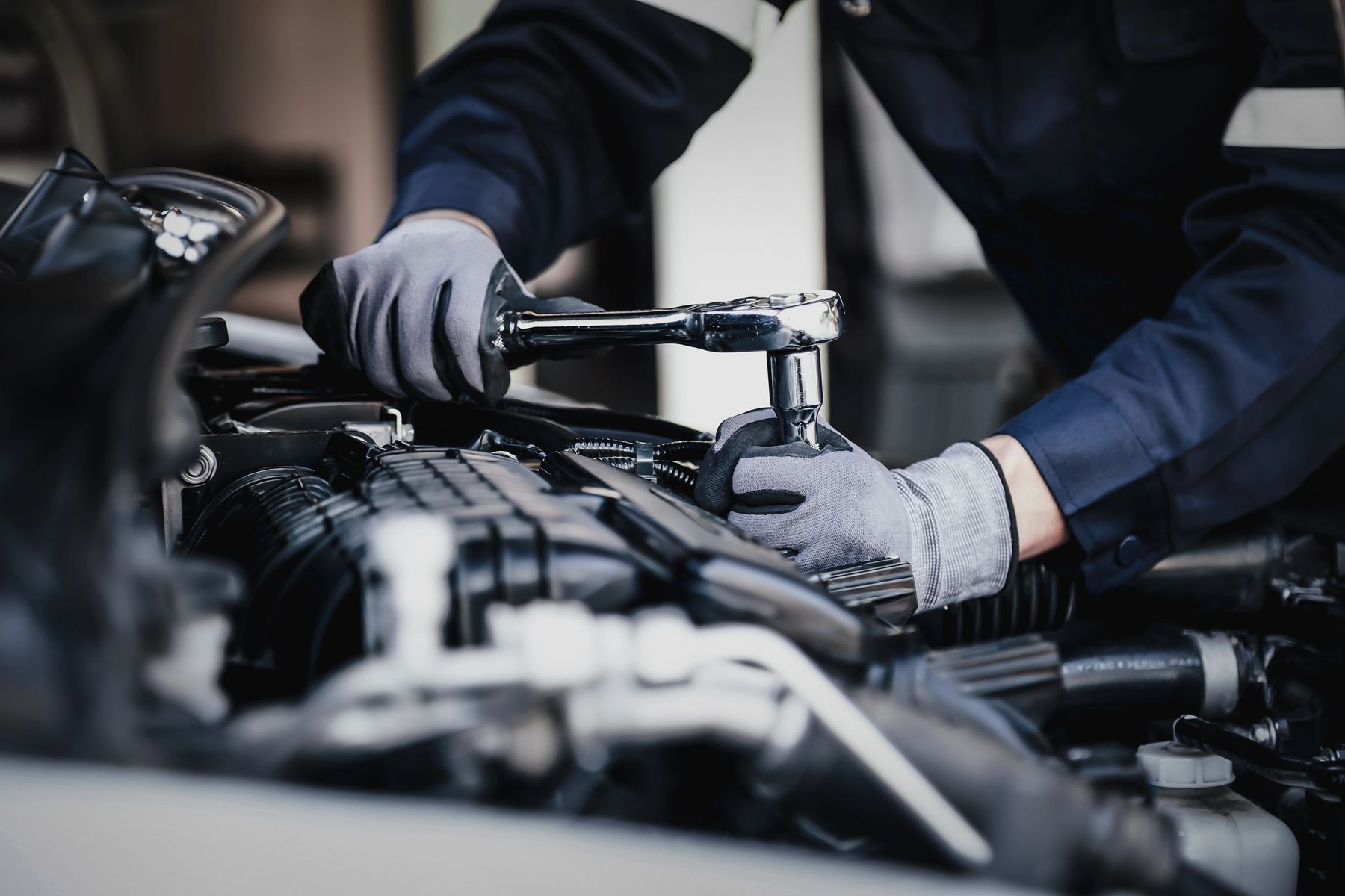 A Mechanic Working on A Car Engine — Geelong Car Repair Centre in Newcomb, VIC