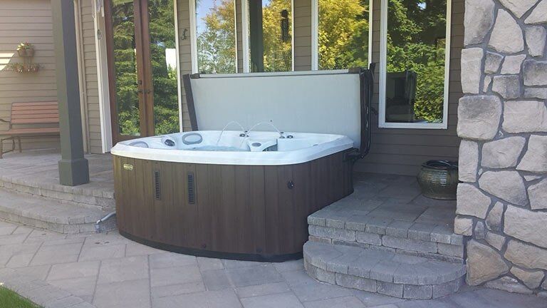 Hot tub under awning - Marquis hot tubs in Oregon and California