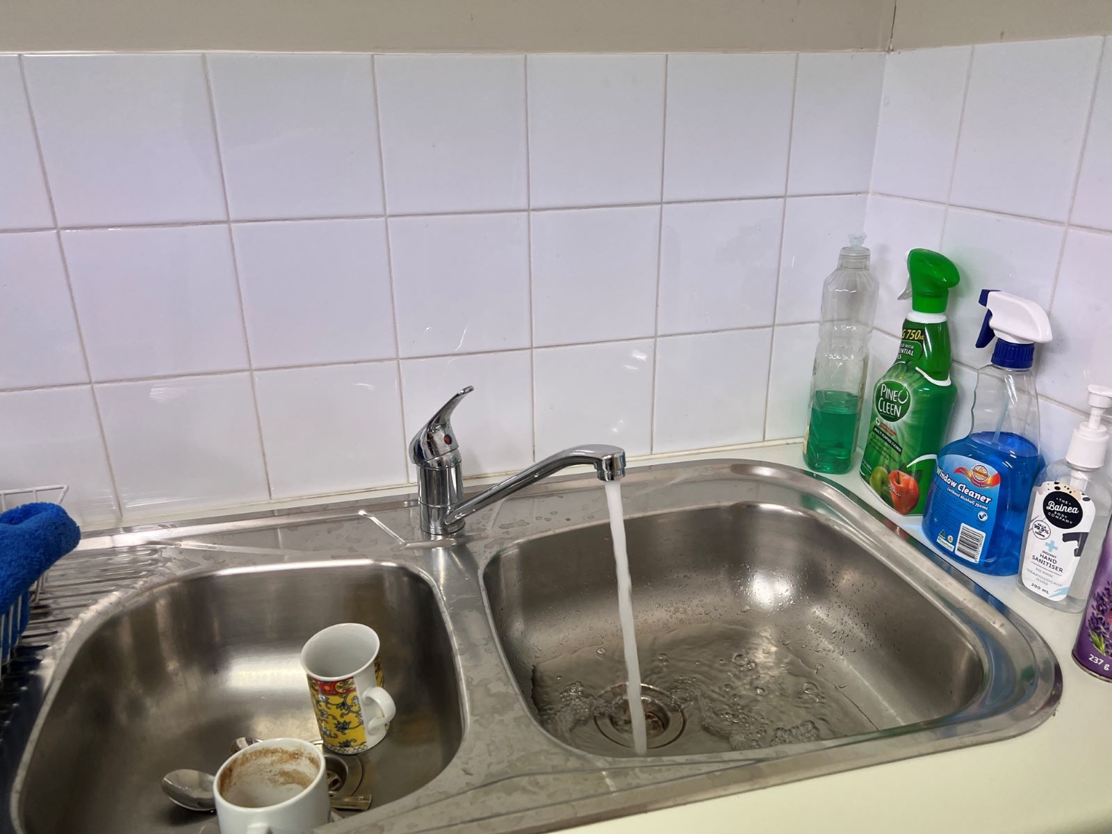 A White Air Conditioner is Hanging From the Ceiling in a Room — Fig Facility Services in Lara, VIC