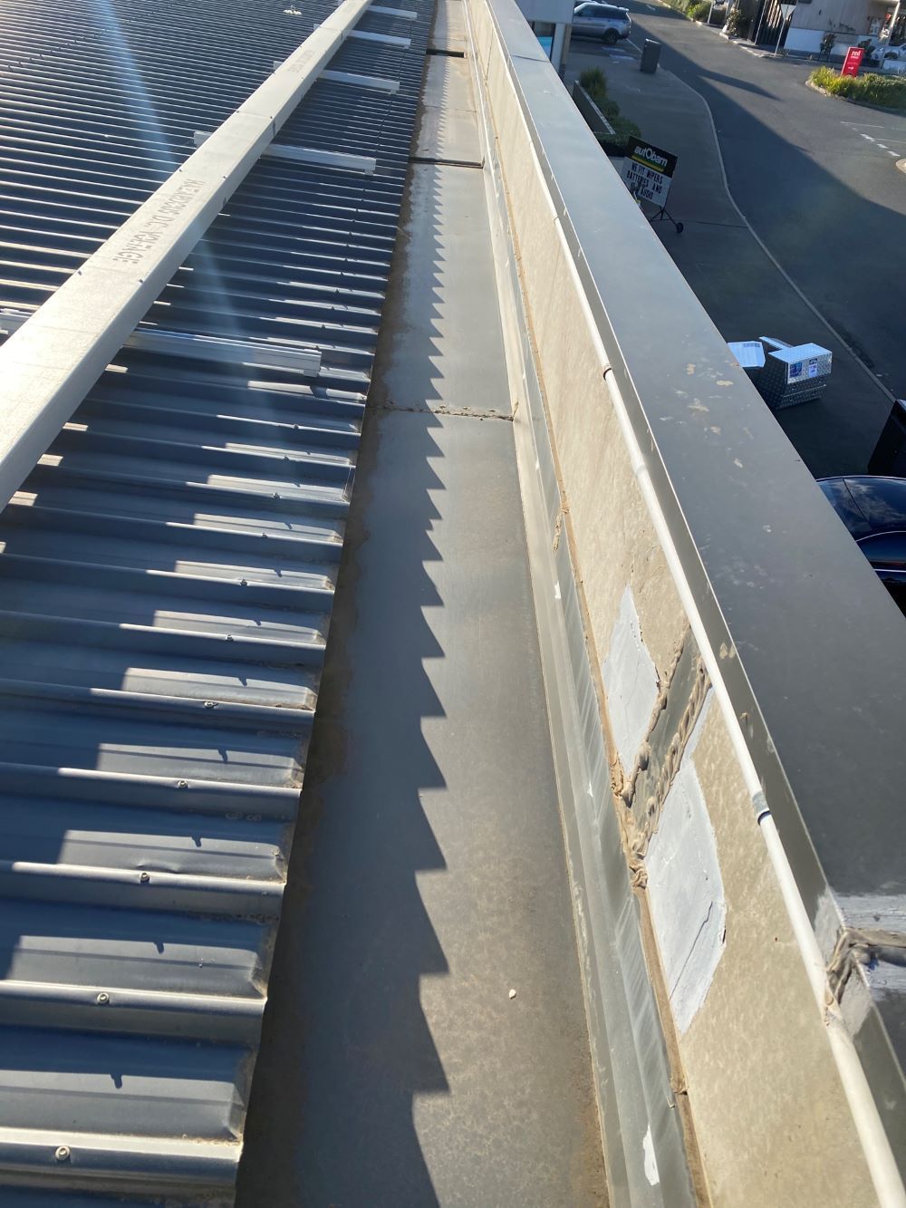 A Gutter on the Side of a Building Leading to a Street — Fig Facility Services in Lara, VIC