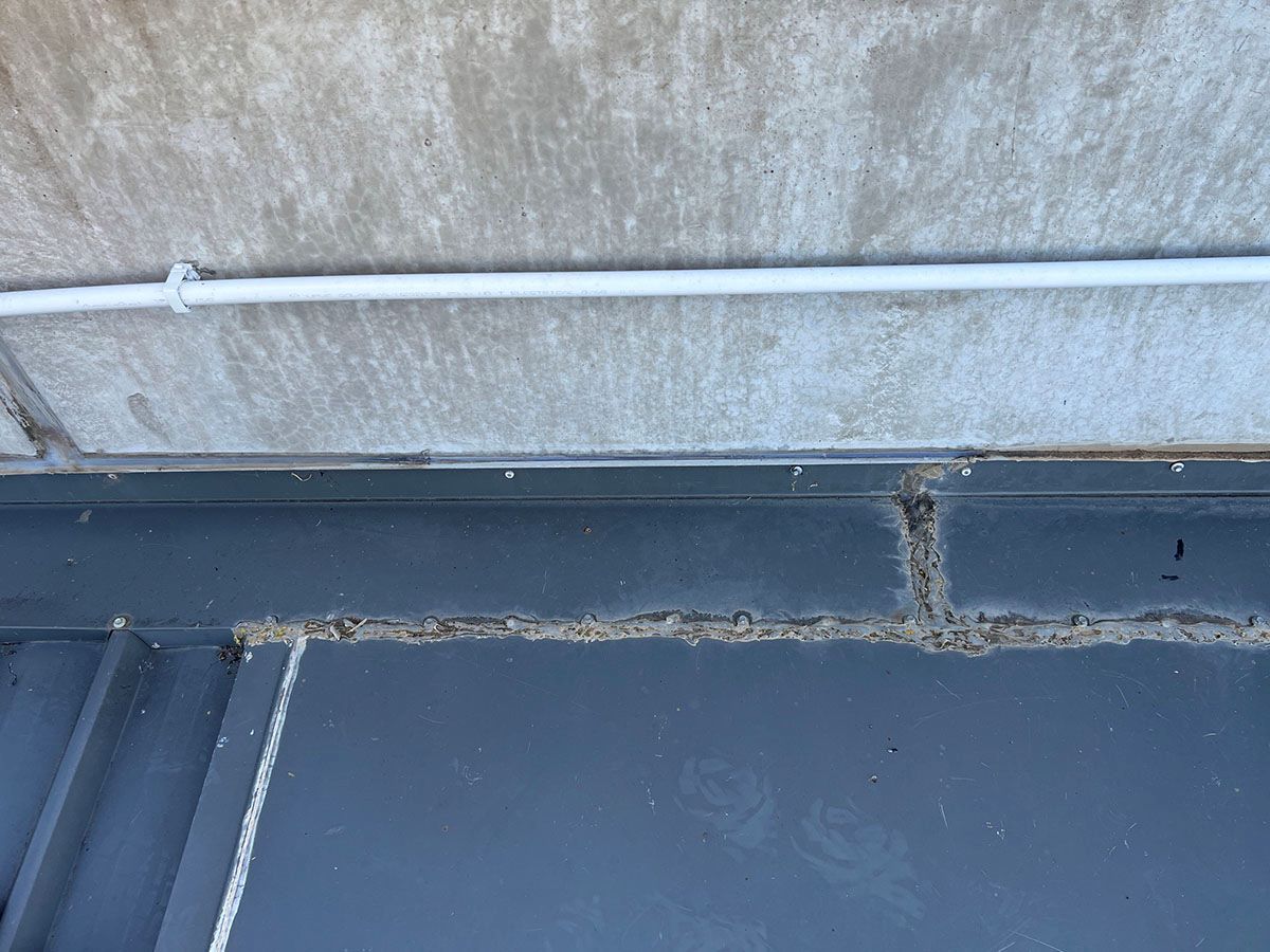 A Close Up of a Roof With a Pipe on It — Fig Facility Services in Lara, VIC