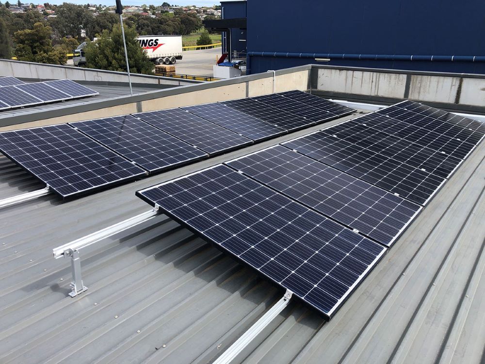 Two Solar Panels Are Sitting on Top of a Roof — Fig Facility Services in Lara, VIC