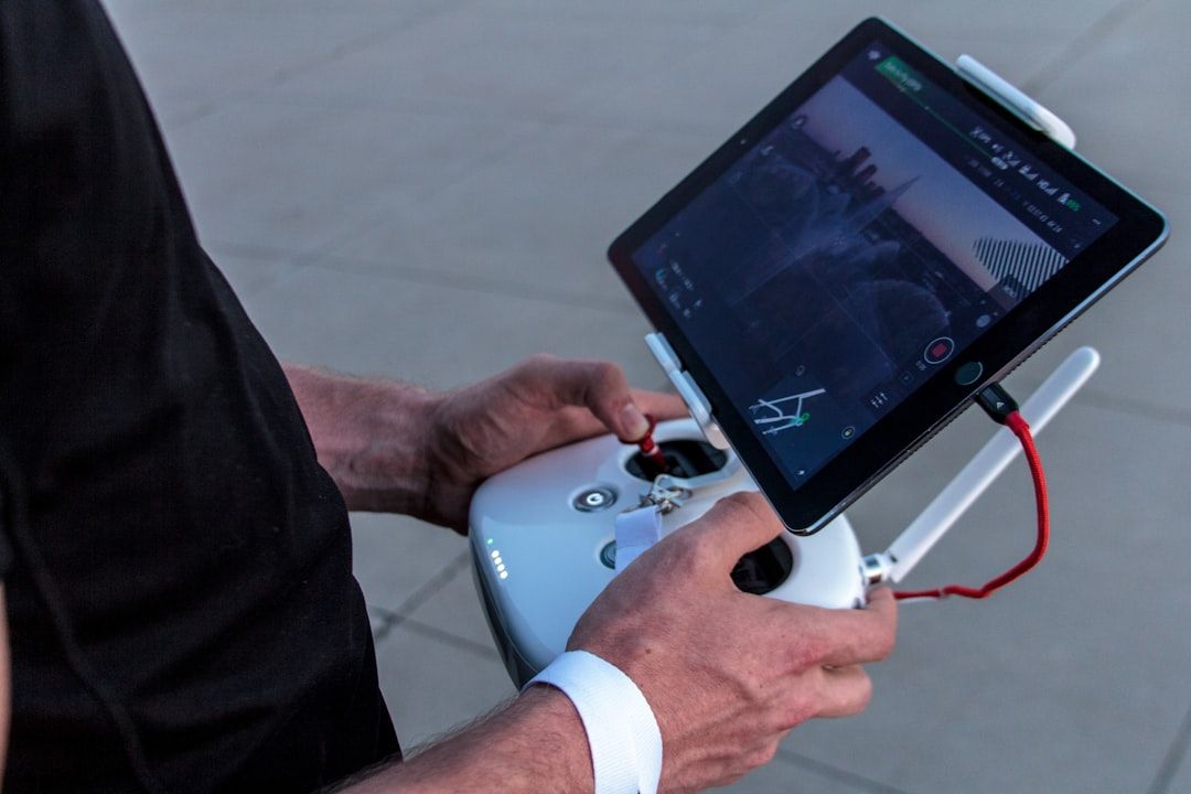 Pilot operating drone controller with tablet