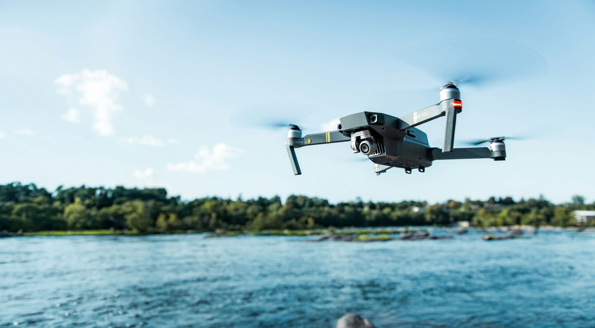 DJI Mavic drone flying over water