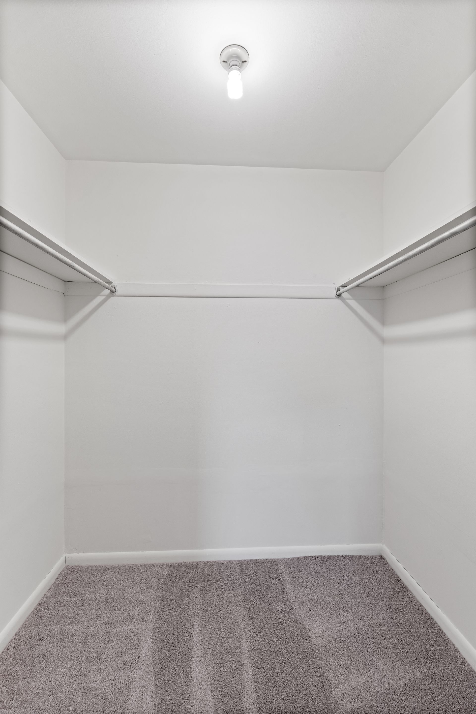 Photo of a walk-in closet with ample storage space